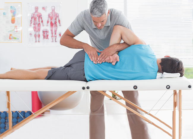 A Doctor Giving Chiropractic Care